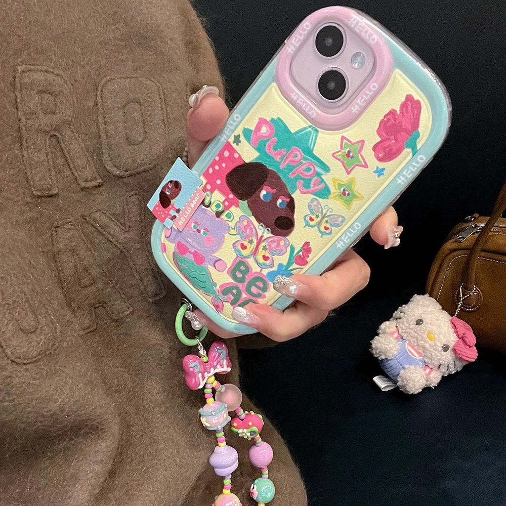 ins涂鸦黑皮可爱小狗带链条适用iPhone16proMax苹果14pro手机壳15