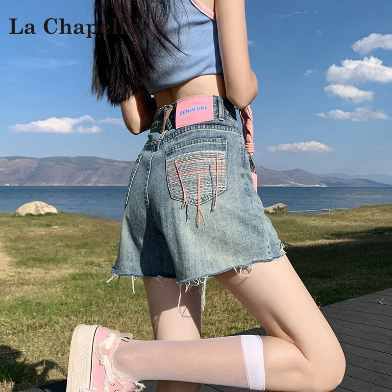 拉夏贝尔蓝色牛仔短裤女春季2025新款流苏毛边高腰显瘦a字热裤子