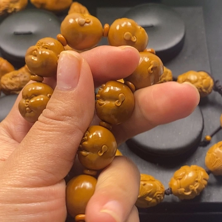 橄榄核吊坠人生百态