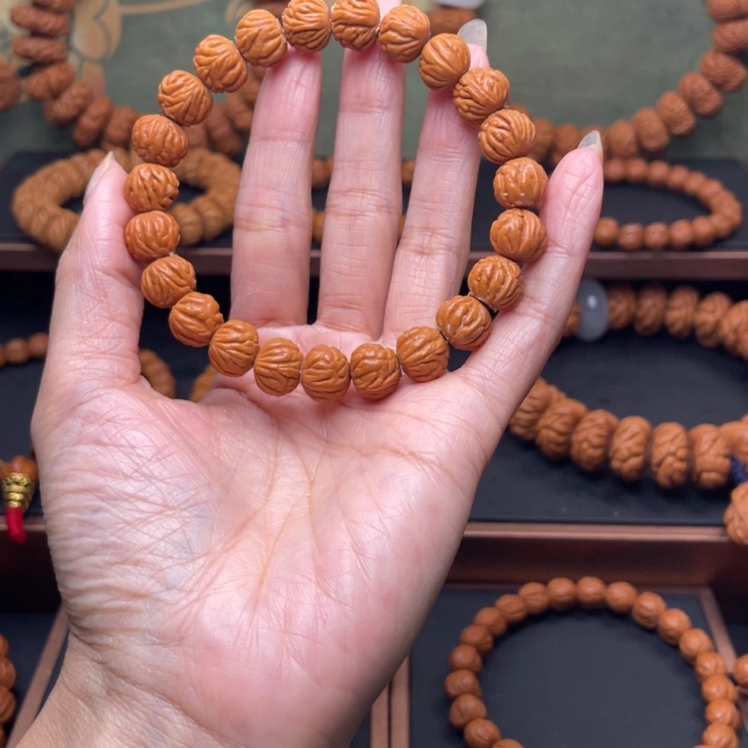 秋***人手串桃核11金蝉纹