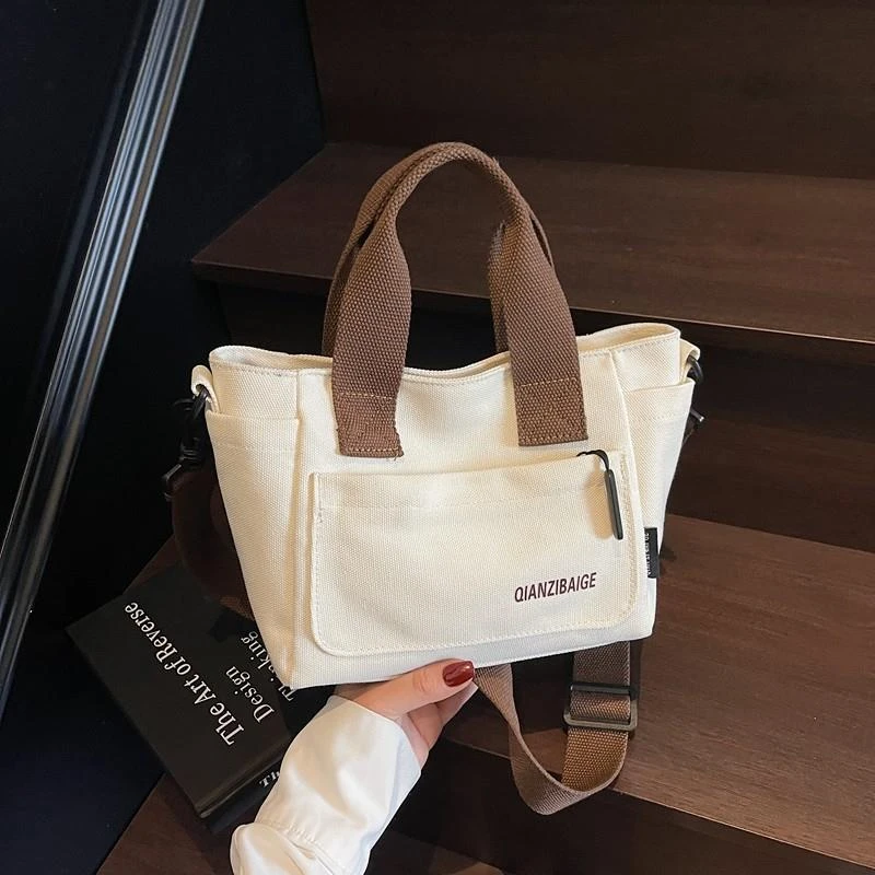 帆布包女斜挎包新款百搭文艺学生小包上课通勤包上班手拎包手提袋