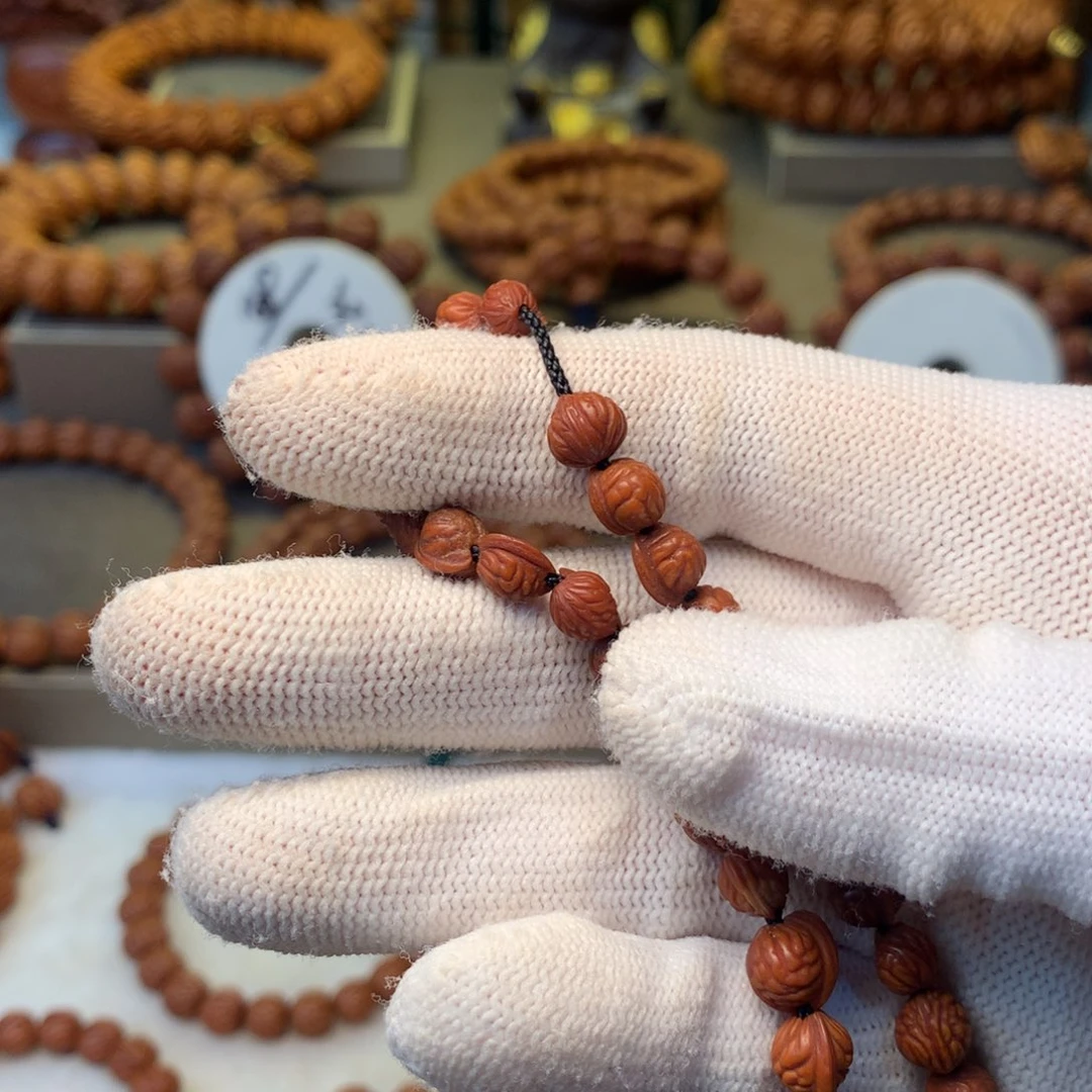 T***S桃核手串秦岭龙纹