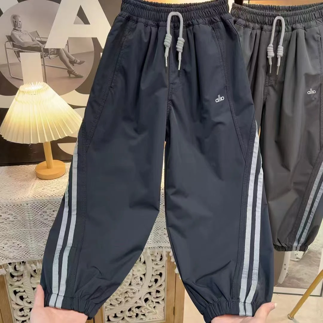 舒适简约~2025男童秋季时髦休闲裤设计感拼接运动束脚裤10591