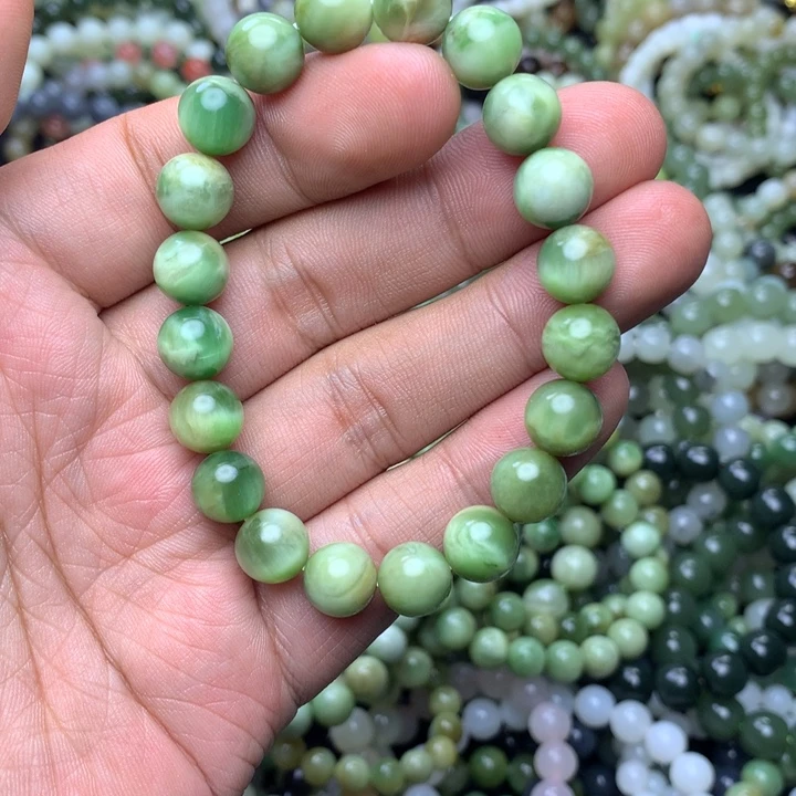 刘***士和田玉未镶嵌手串黑羊洞