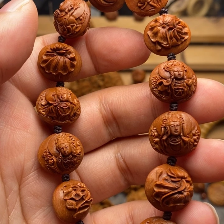 心**飞桃核手工雕刻观音手串