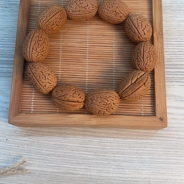 钱袋子桃核素串手串