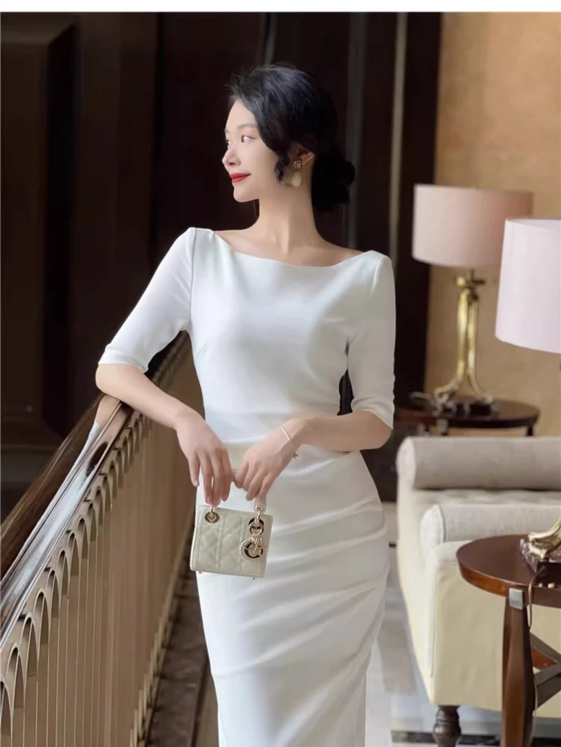 秋冬白色长袖连衣裙女收腰法式高级感赫本风小众设计一字肩长裙子