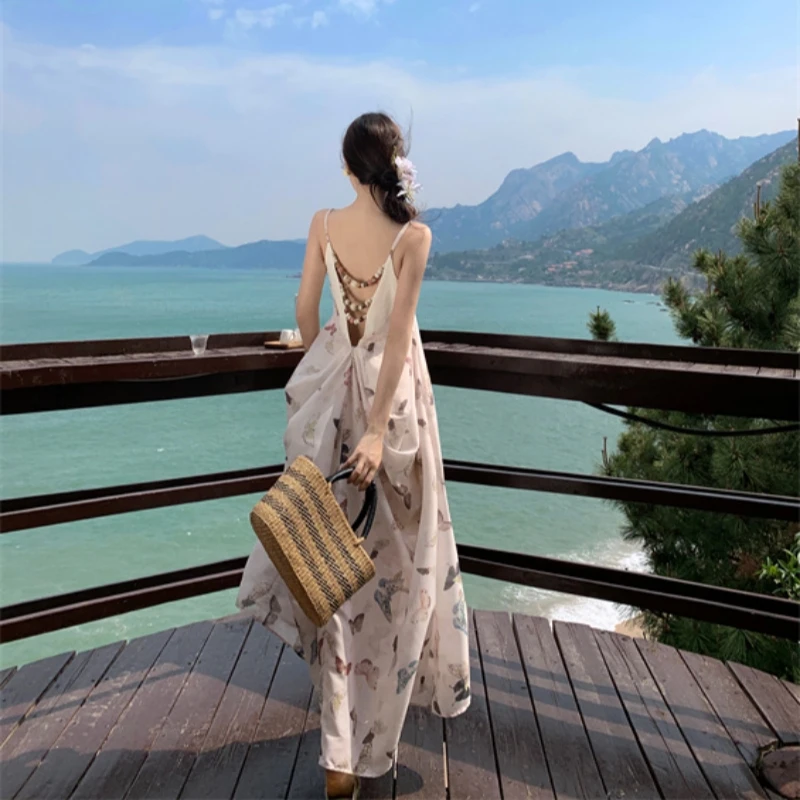 海边度假沙滩裙夏季重工新中式露背中长连衣裙女收腰a字吊带长裙