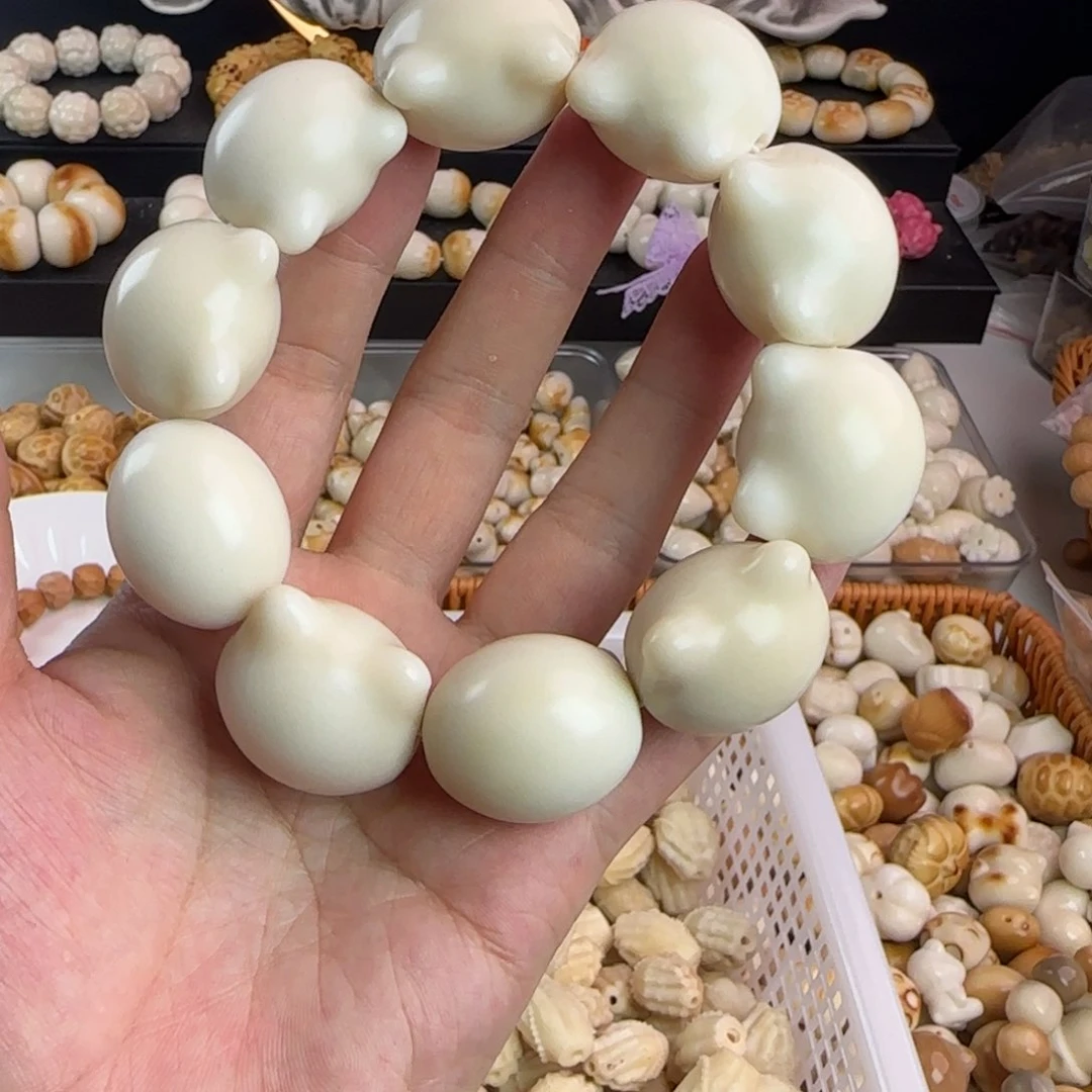 咕***咕菩提根/象牙果吊坠微瑕疵大卡猫头手串一条