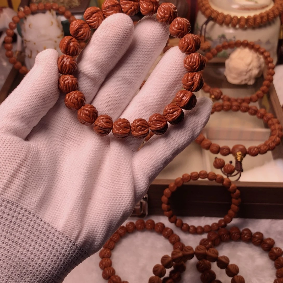 梅***国手串桃核13双脊龙手串