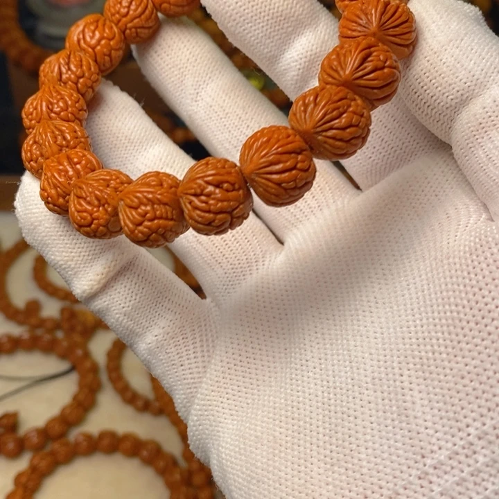 默***、桃核手串秦岭龙纹桃核