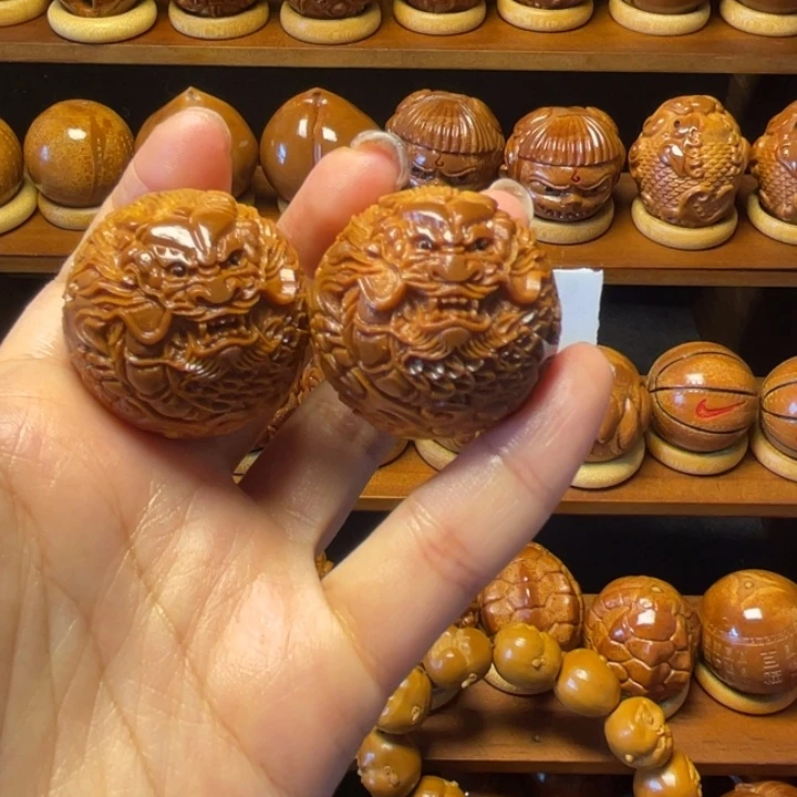 橄榄核把件浊**舟龙珠一对