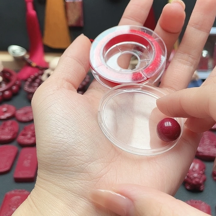 天然辰砂12mm帝王砂一颗 +4个黑隔片+弹力绳