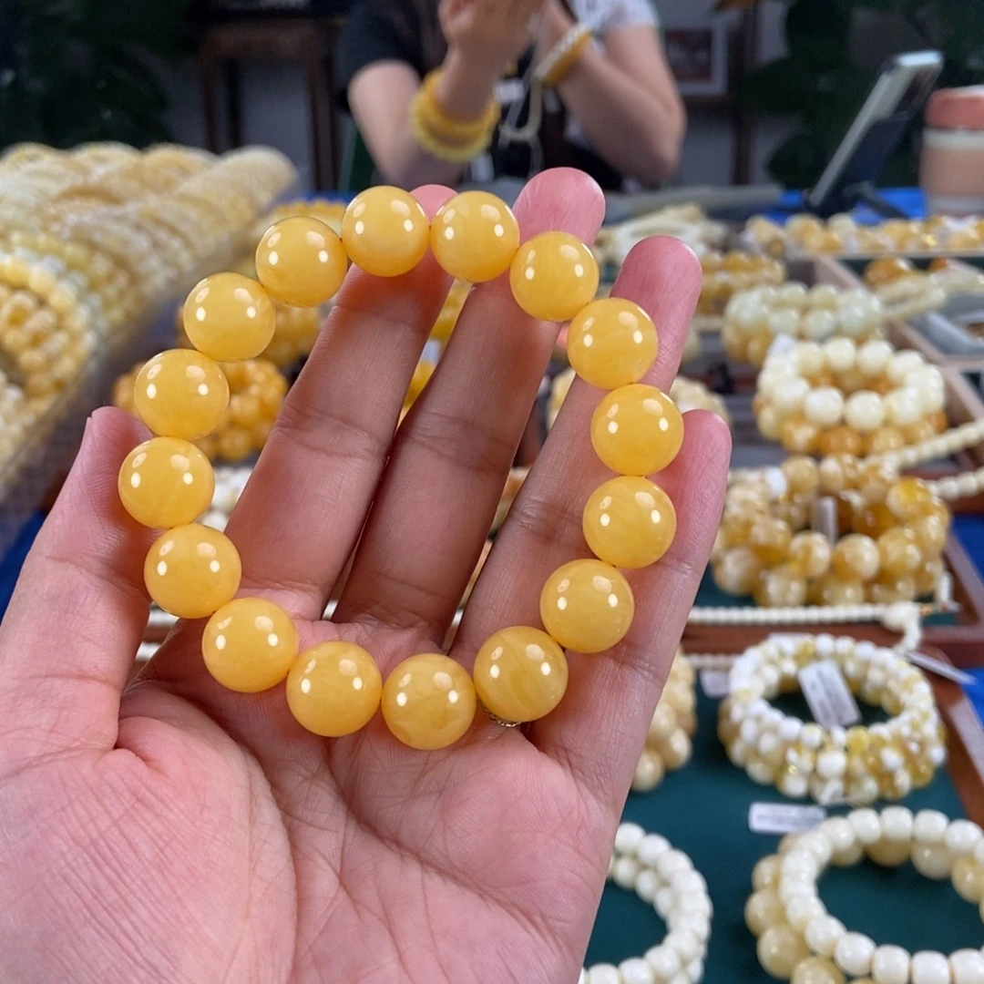 琥珀未镶嵌珠宝奇石13同料鸡油红圆珠21.17