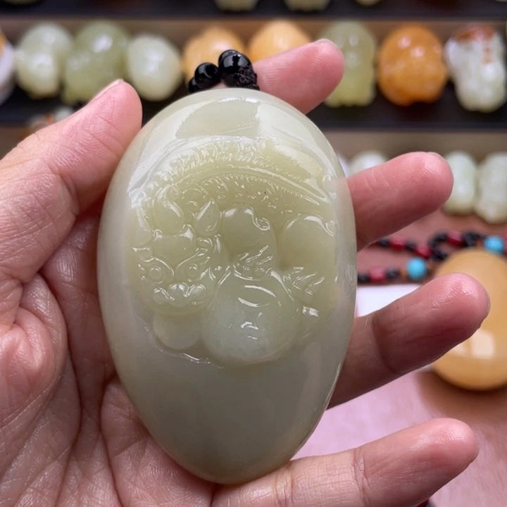 金***海石材古青石手把件