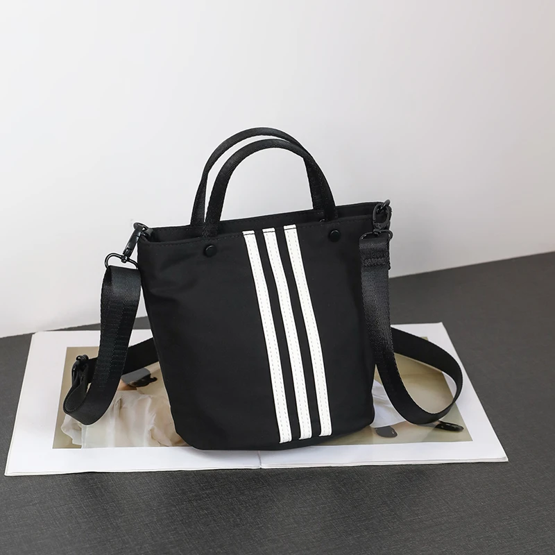 小众三条杠手提包休闲百搭水桶包新款牛津布小拎包单肩斜挎包EEM