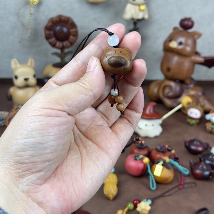 实木小狗手机链一个