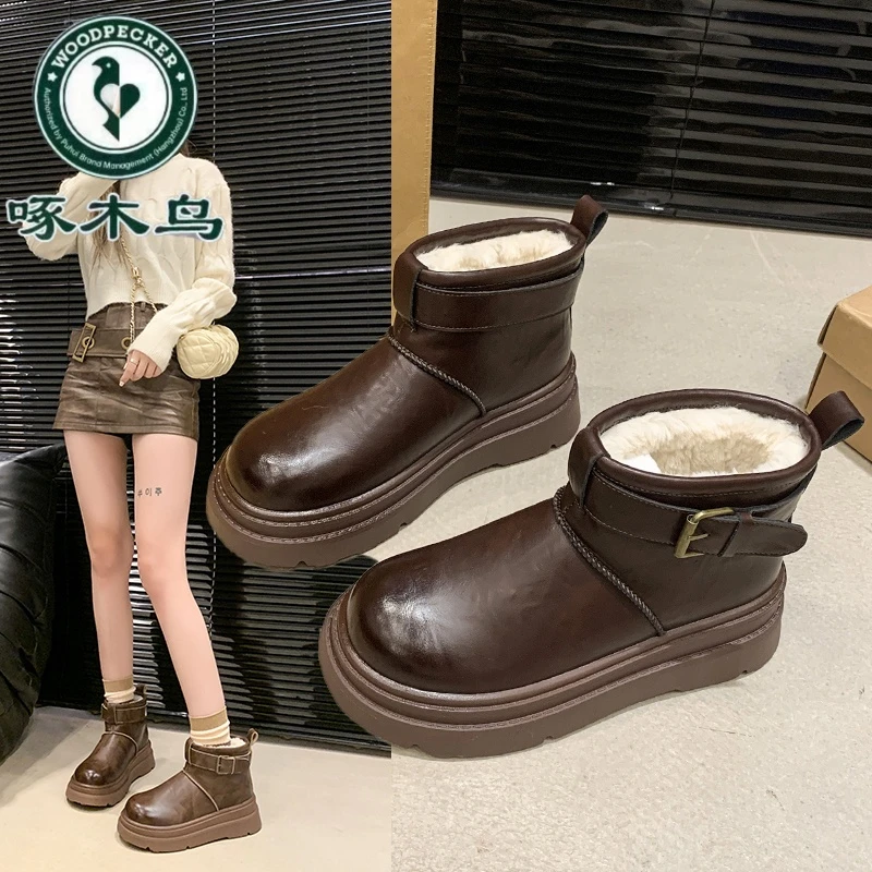 啄木鸟厚底雪地靴女2024冬新款皮面防水马丁短靴加绒保暖东北棉鞋