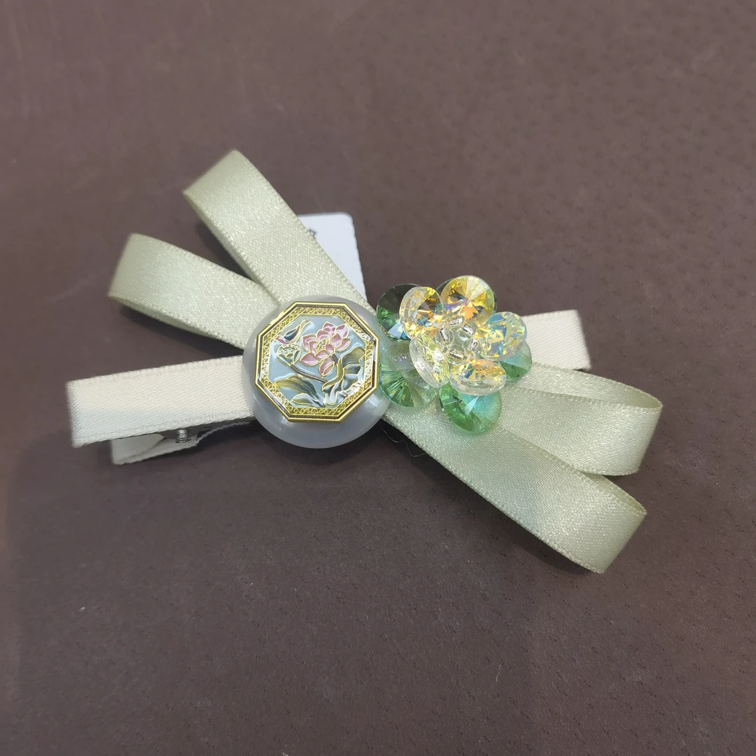 F951绿色蝴蝶结花花闪闪边夹