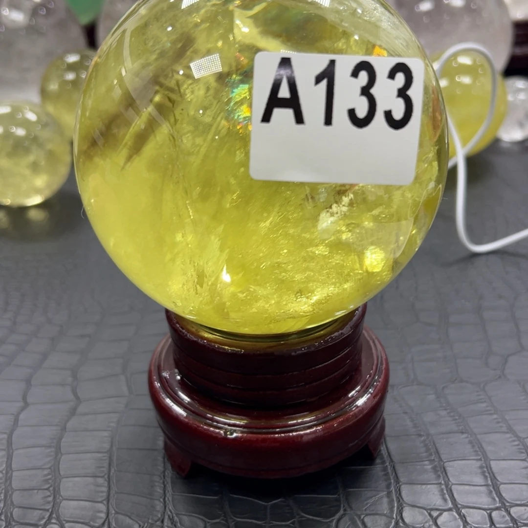 亳***制石材天然黄水晶球11.3