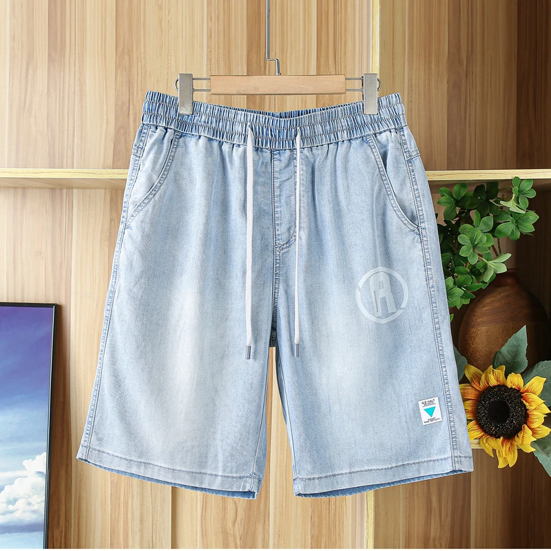 64%天丝牛仔短裤男夏季薄款透气青年男士浅蓝色松紧腰宽松五分裤