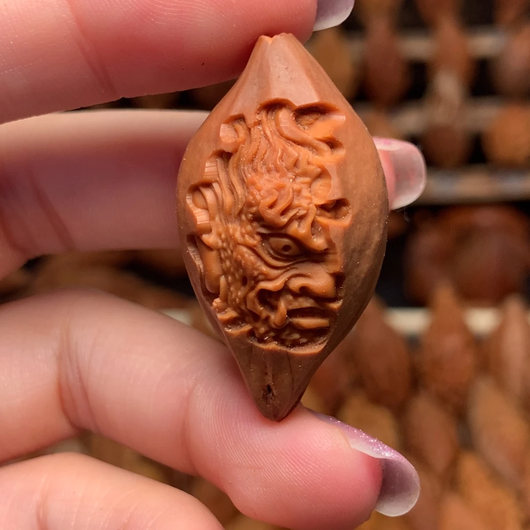 把件橄榄核包衣一念