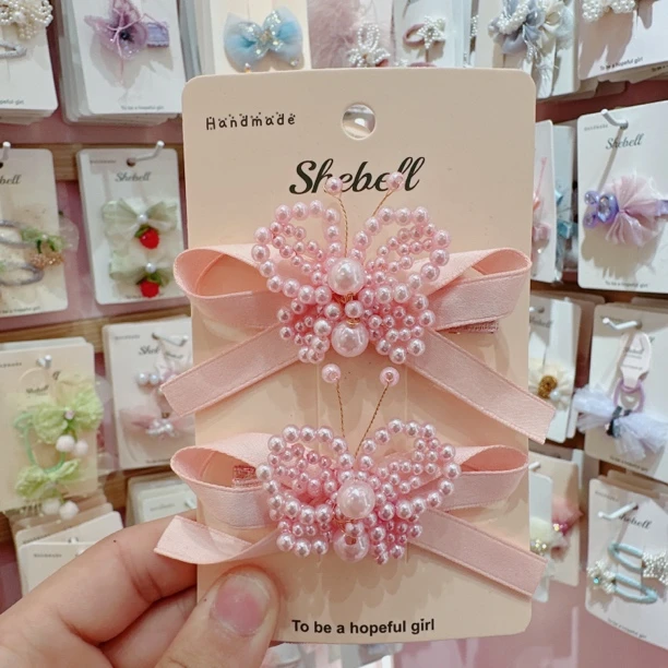 c0561-X粉色珍珠蝴蝶压夹一对【满15包邮发货】