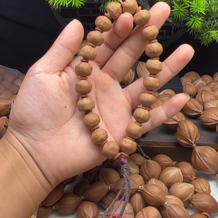 李***九橄榄核手串/手链1.2*1.1三花原皮铁核