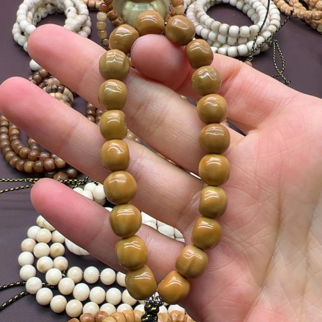 羽***绒吊坠龙脊菩提原籽