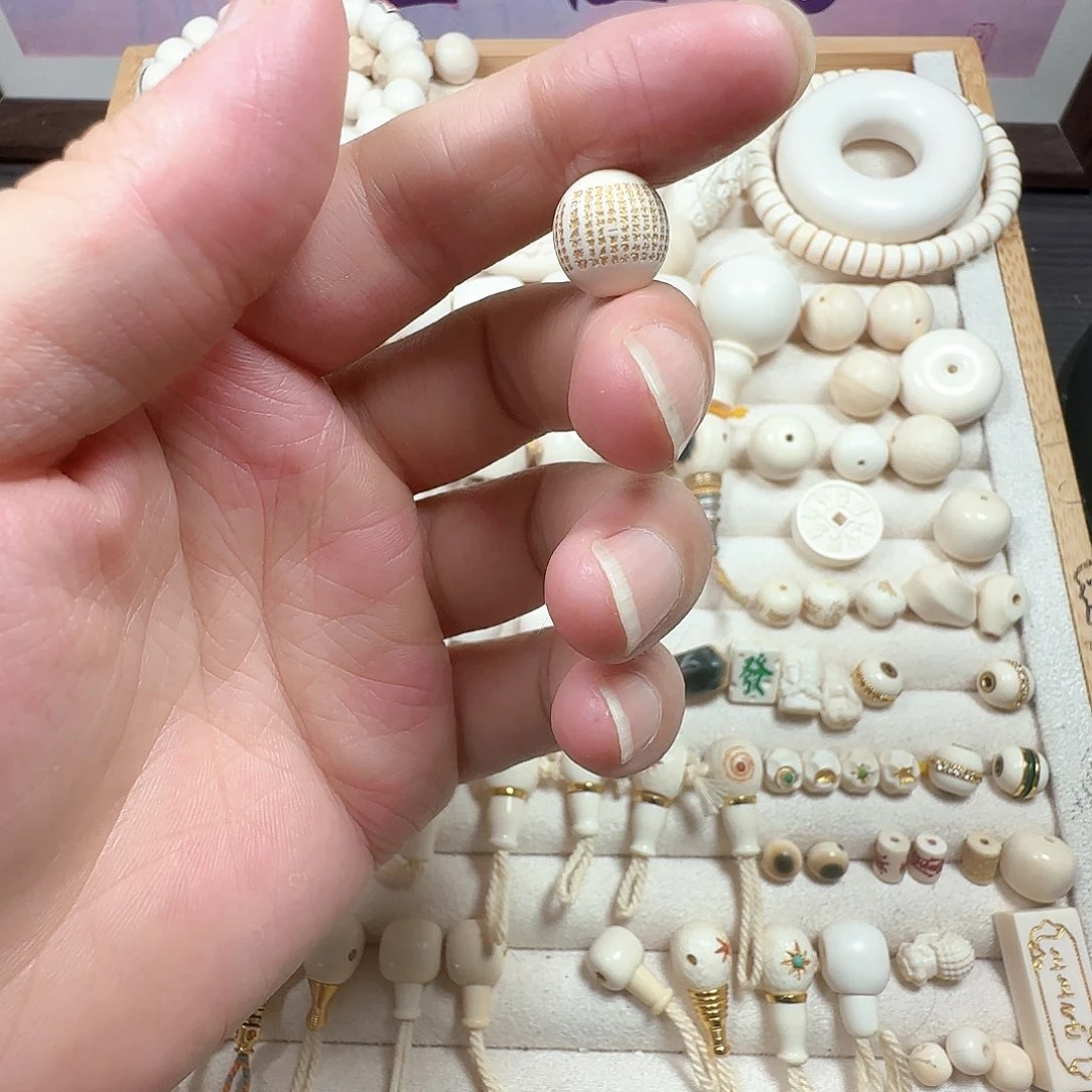 陇***店猛犸牙心经珠1.0圆珠