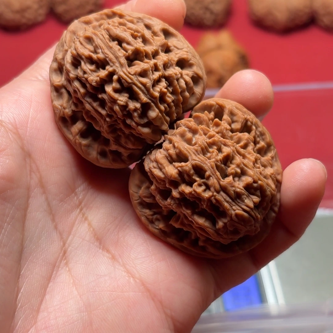 桃核把件南疆石万字纹精对