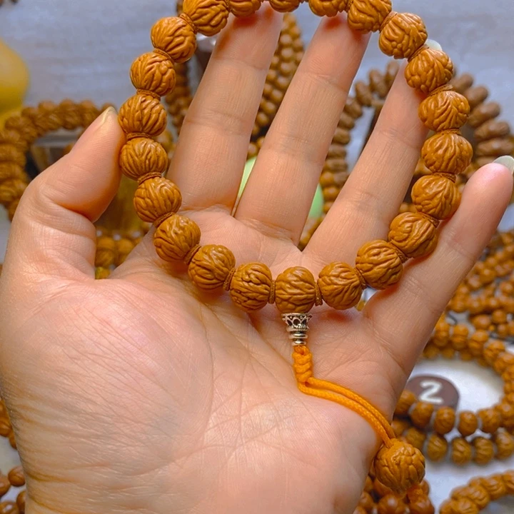 吊坠桃核金蟾籽手持