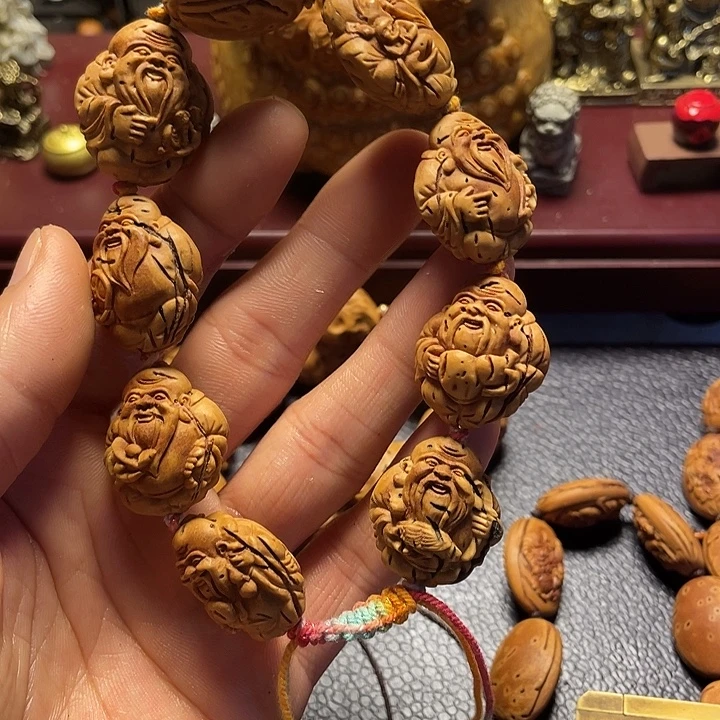 大桃核雕刻寿星手串