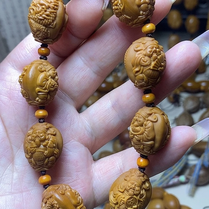 橄榄核雕刻手串龙财