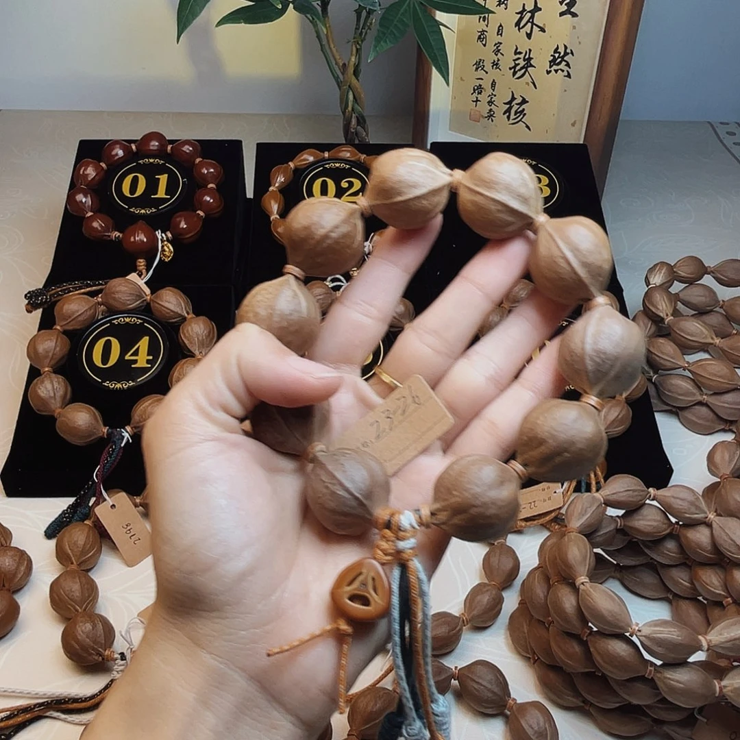 张***三手串橄榄核梅林铁核223*26