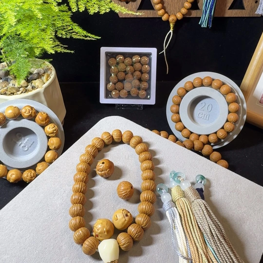 时***暖猴头核桃手串磨盘凤羽