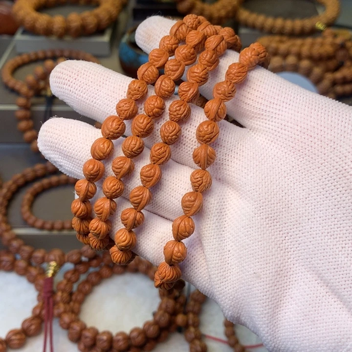 阳***强桃核手串秦岭龙纹