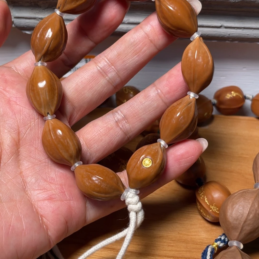 橄榄核吊坠人**途金标铁素