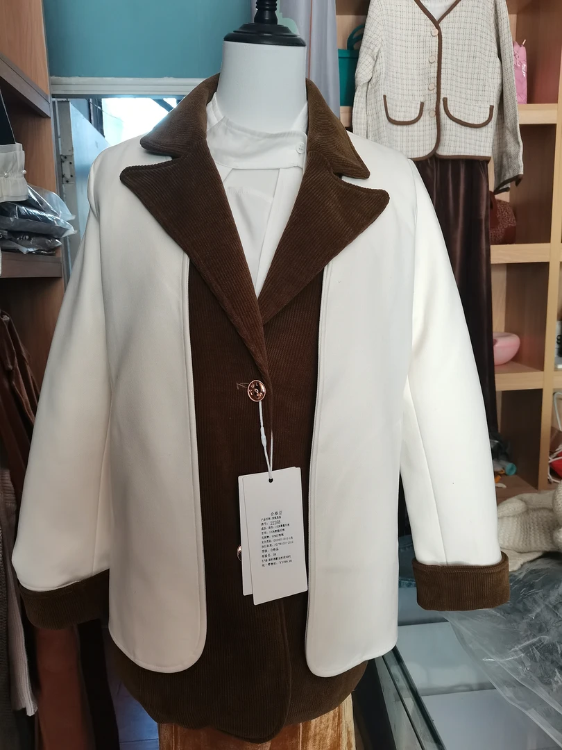 女中西服款假两件保暖羽羽棉服看吊牌