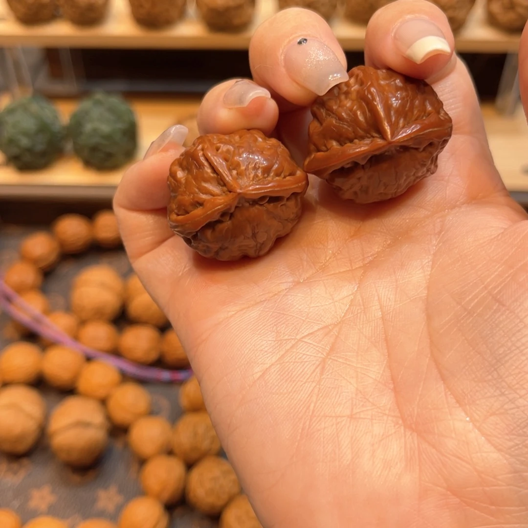 文玩核桃把件老籽丁三棱