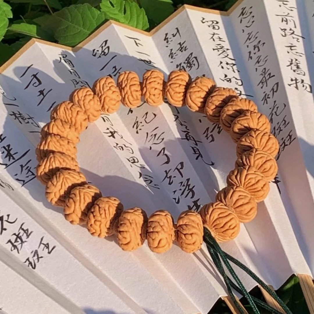 秦岭龙纹桃核高颜值精品飞碟树王纽扣桃核手串手持伏魔圈男女同款