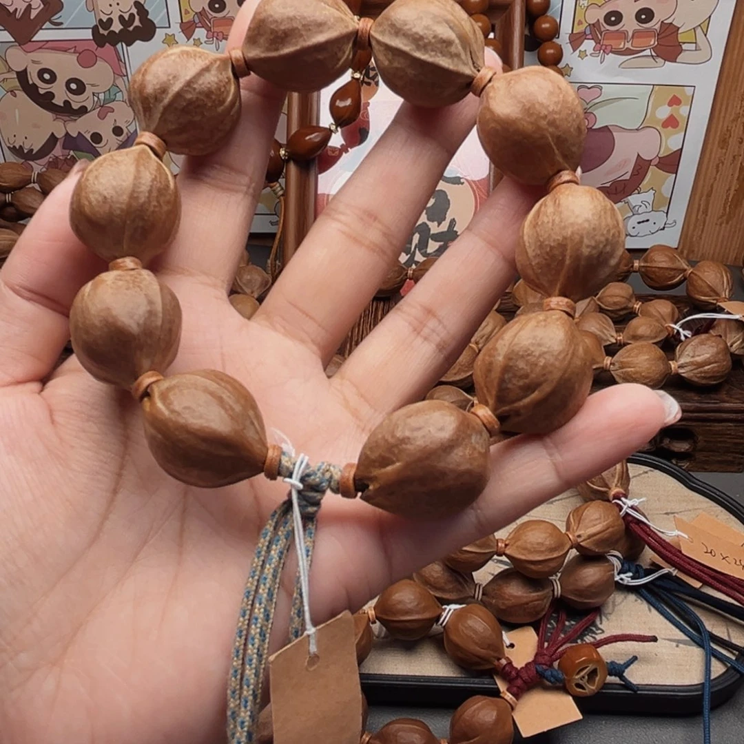 至***华手串橄榄核21.25梅林铁核