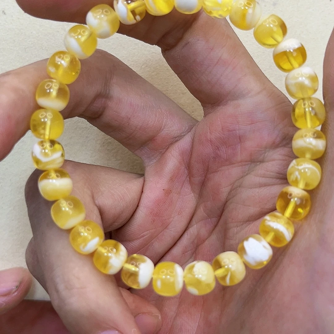 S***.琥珀未镶嵌裸石7.7mm金瓷白手串