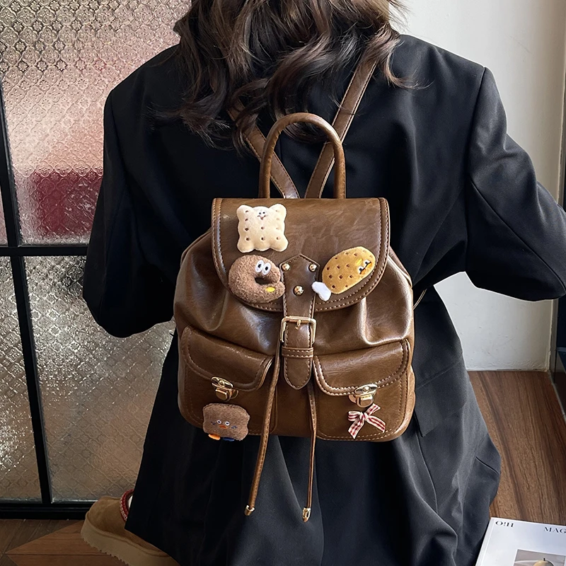 高档复古百搭可爱挂件双肩包学生软皮收纳小背包女童中大童出游包
