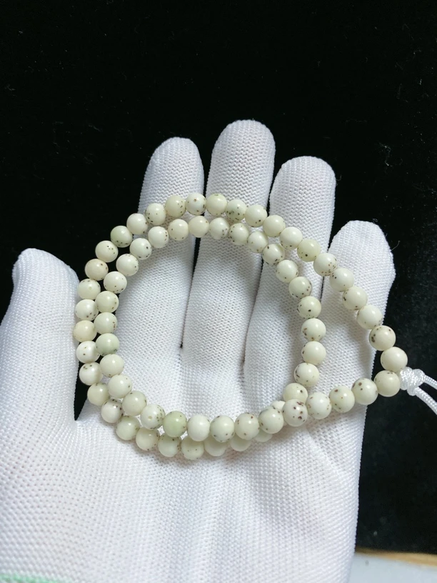 海南料原生态石玉料骨瓷白6×6圆珠河豚双圈手持星月菩提