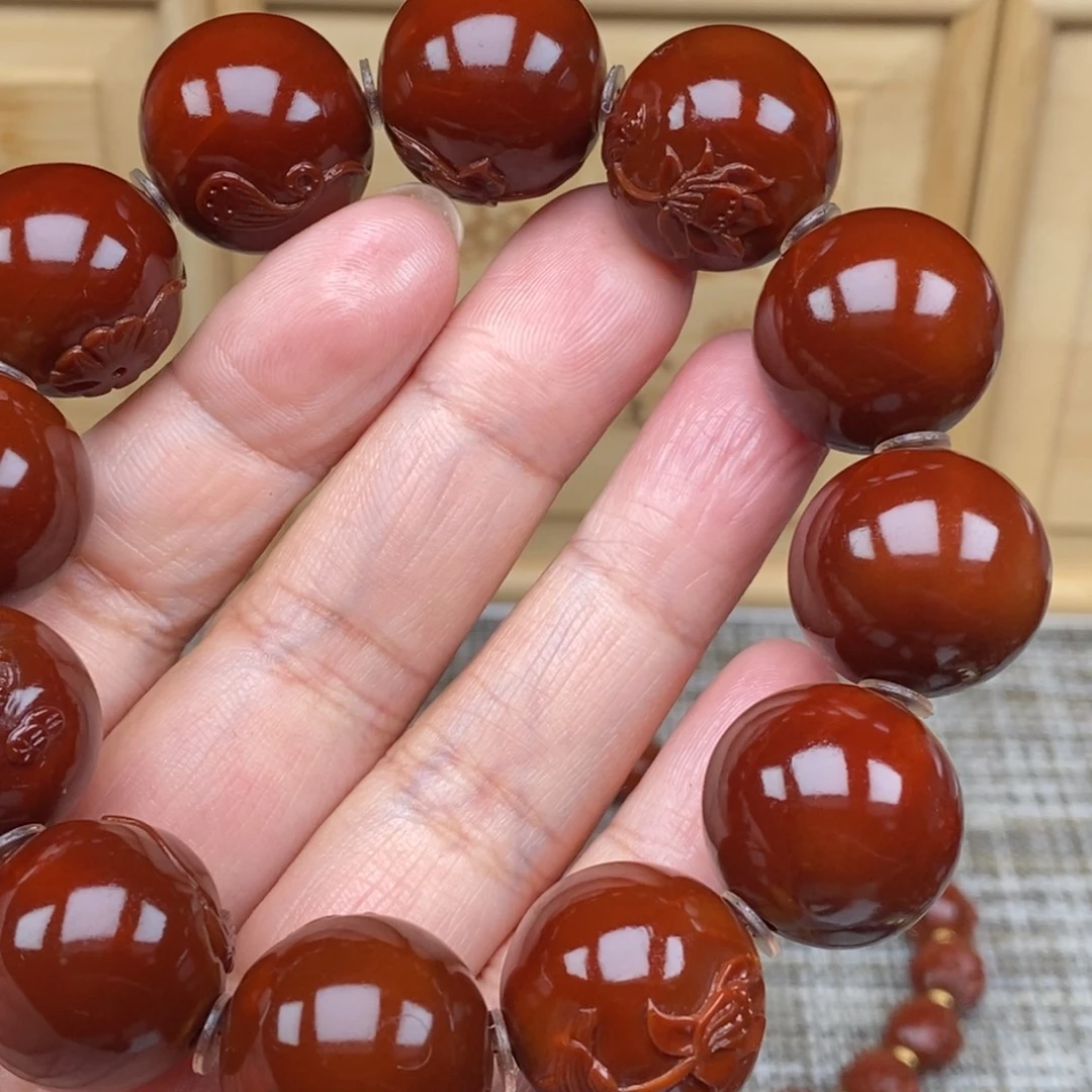 奋***.橄榄核吊坠连年有余