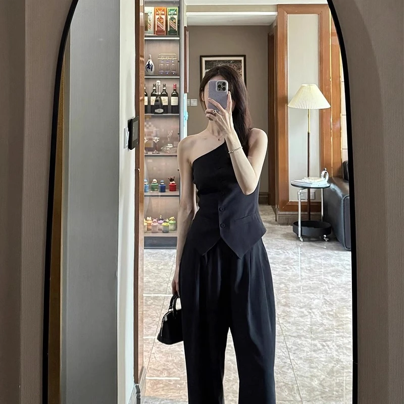 高智感黑色西装马甲两件套女2025年夏小众设计感斜肩上衣长裤套装