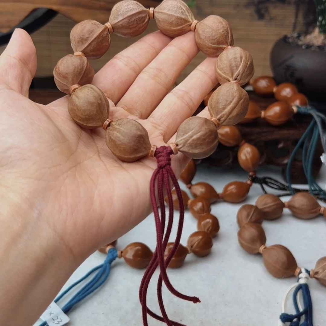 潇***哥橄榄核手串20*25三花核串