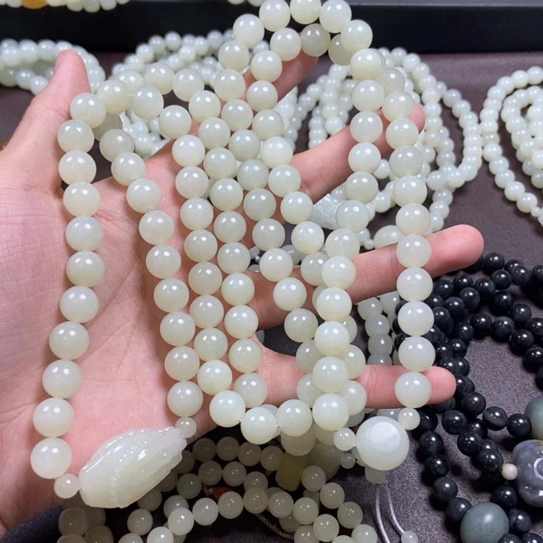 许***平和田玉未镶嵌把件