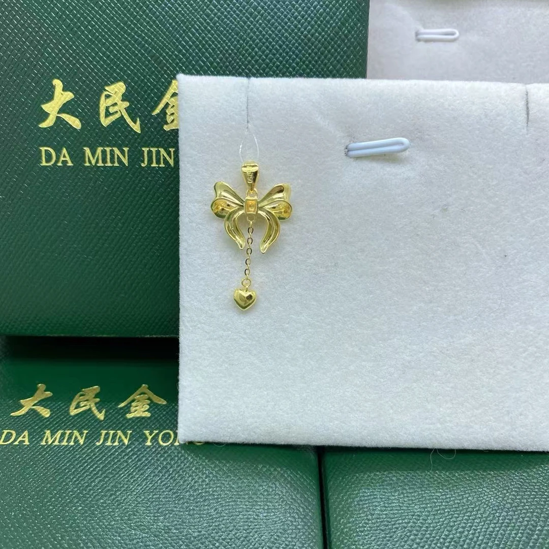 大民金用#7350黄18K金Au750蝴蝶结精品吊坠克重多退少补